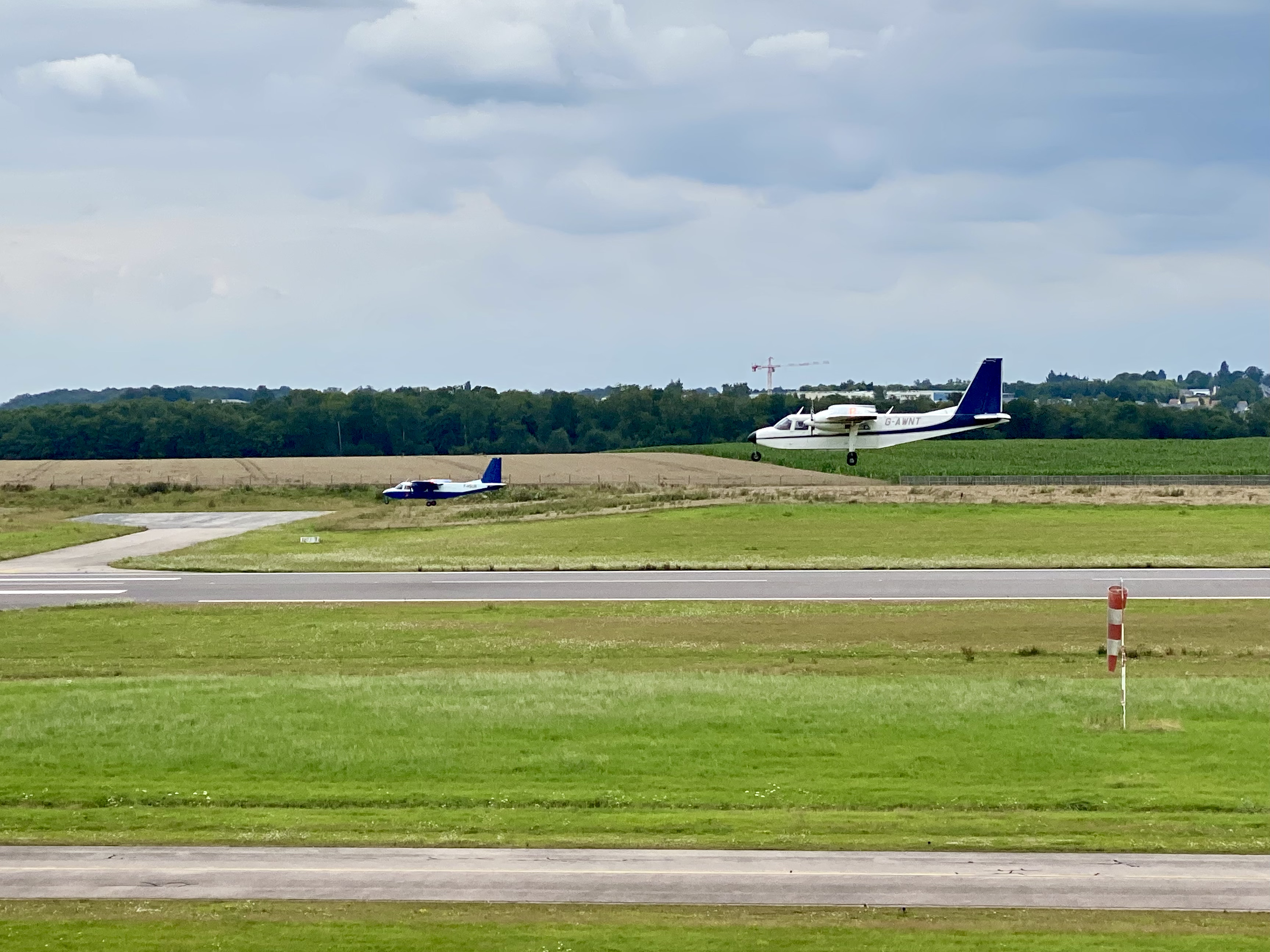 Two BN-2s performing a low pass over the runway in Rouen