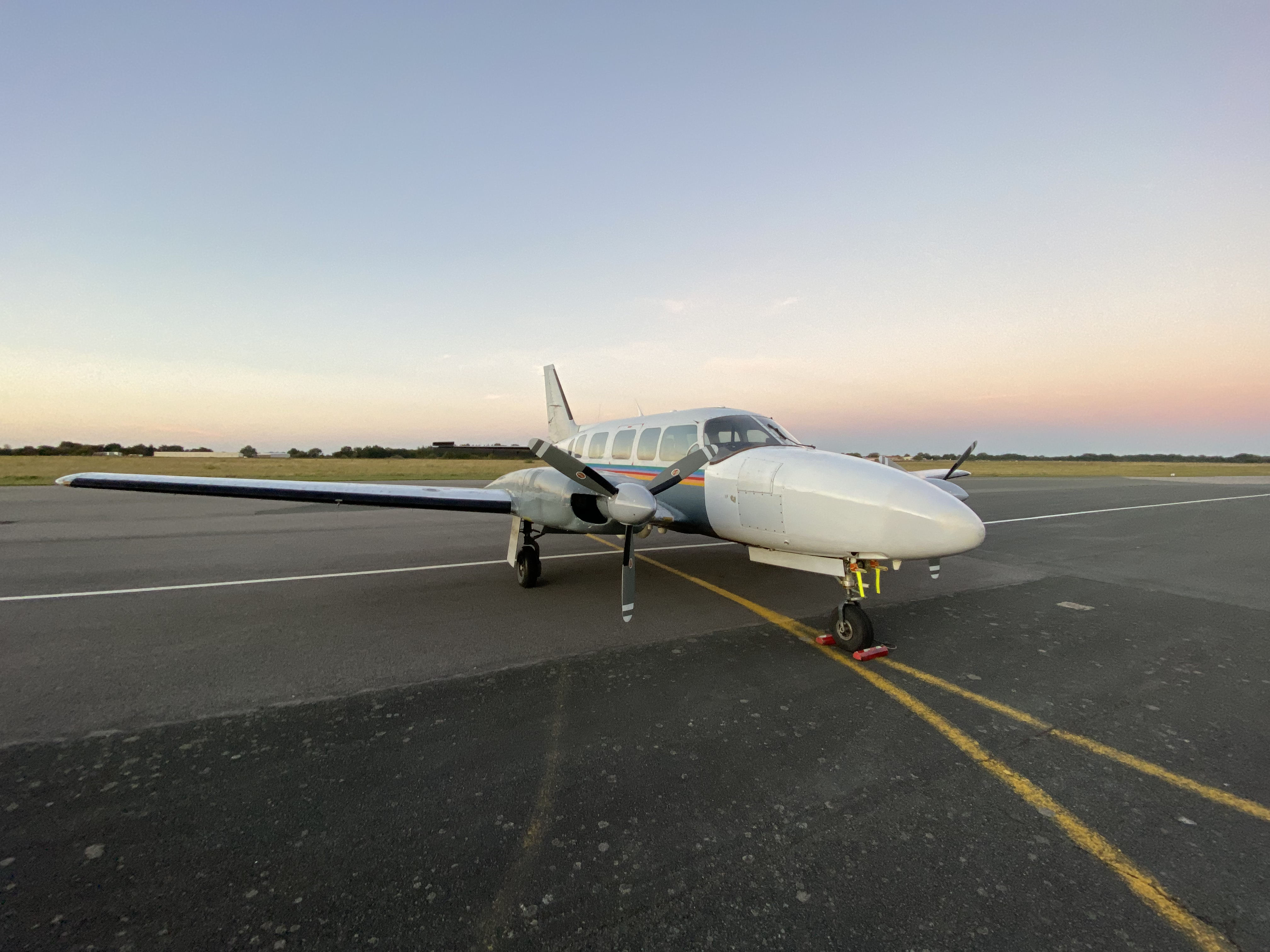 A PixAir Survey PA31 pictured parked on the apron at La Roche-sur-Yon airport at dusk