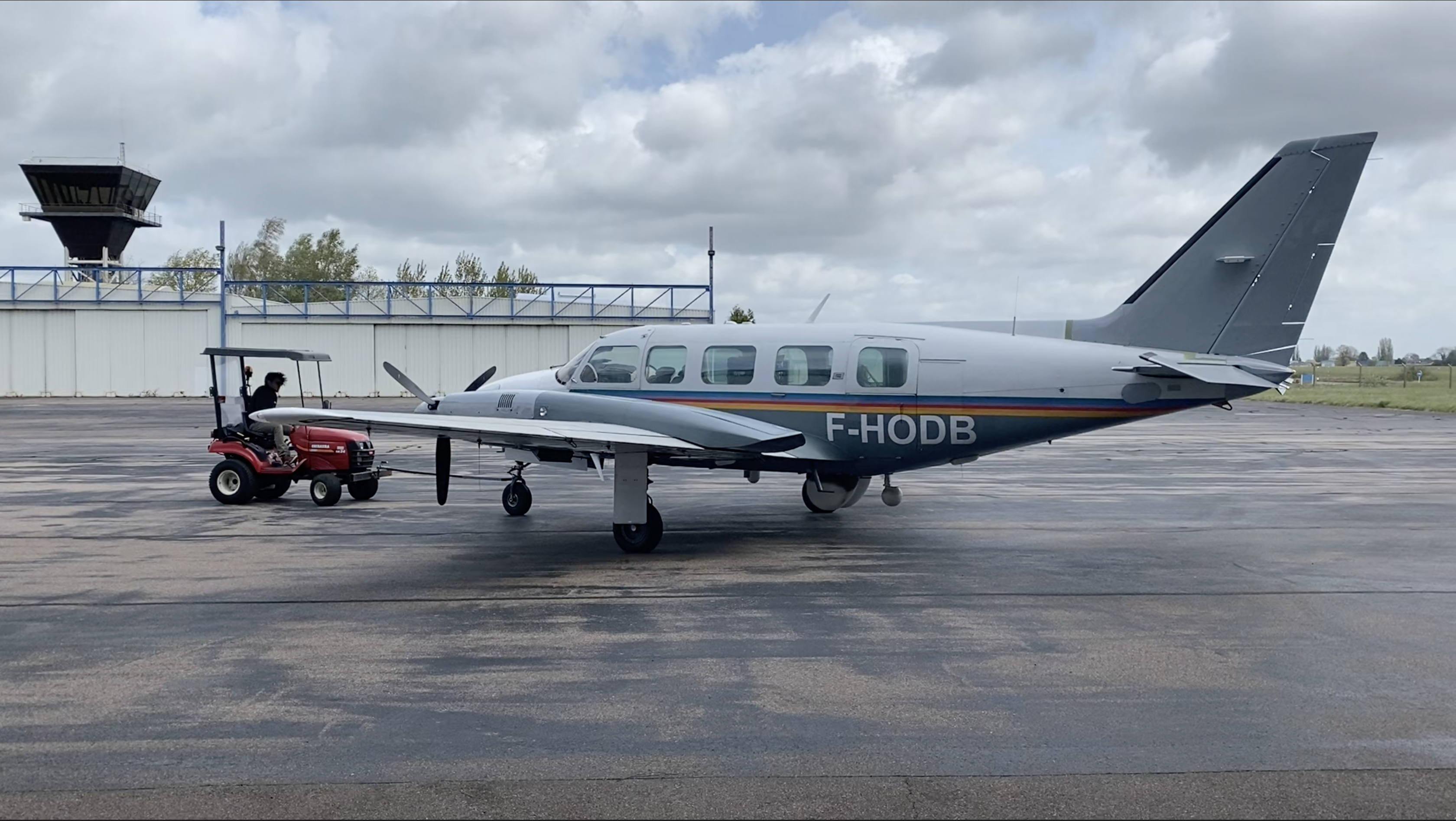 PA31 being towed outside an aircraft hangar